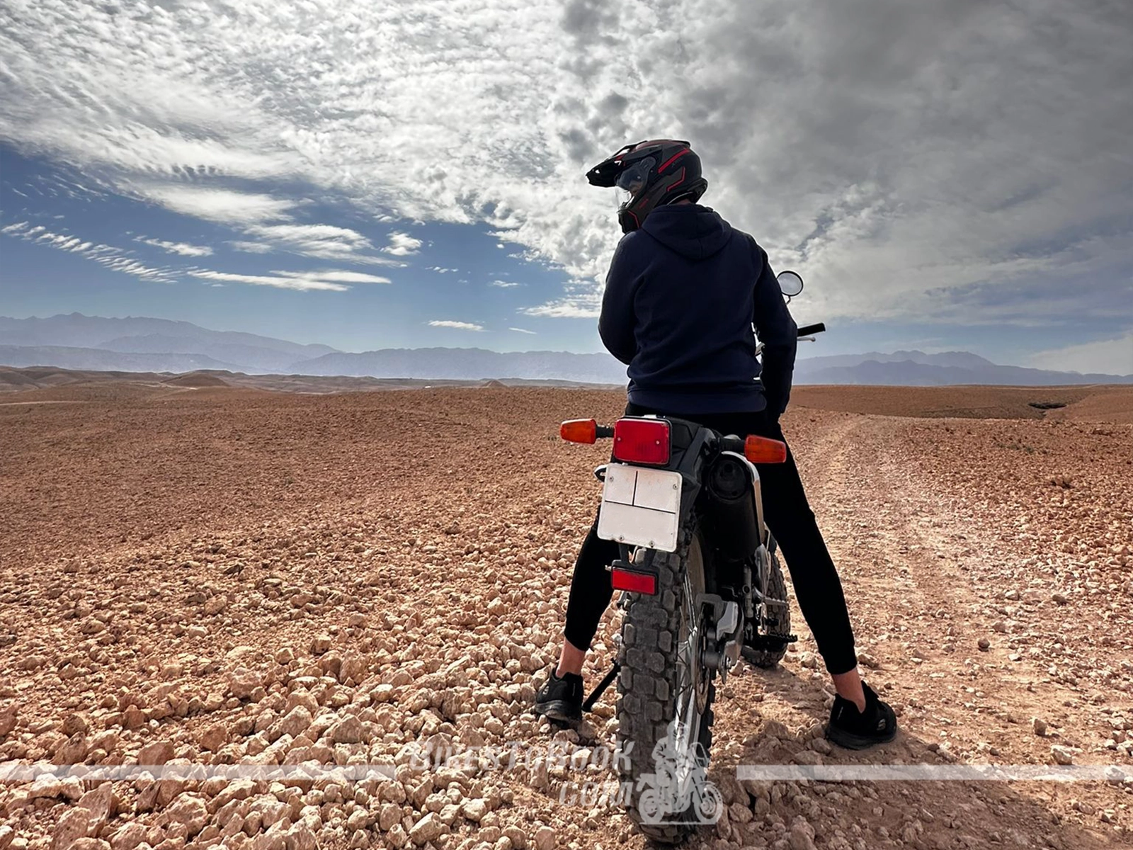 Yamaha XT250 motorcycle riding through the Agafay Desert near Marrakech Morocco