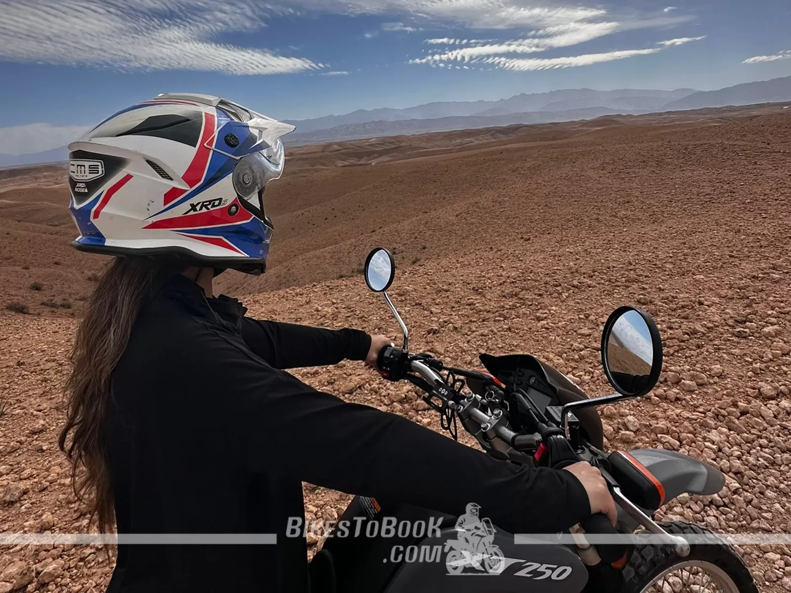Motorcycle trip through Agafay with Atlas Mountain views